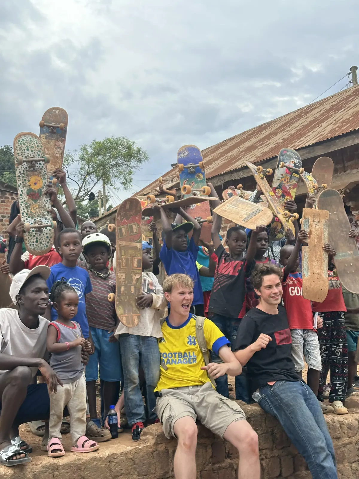 KSI members and international visitors with children in the community