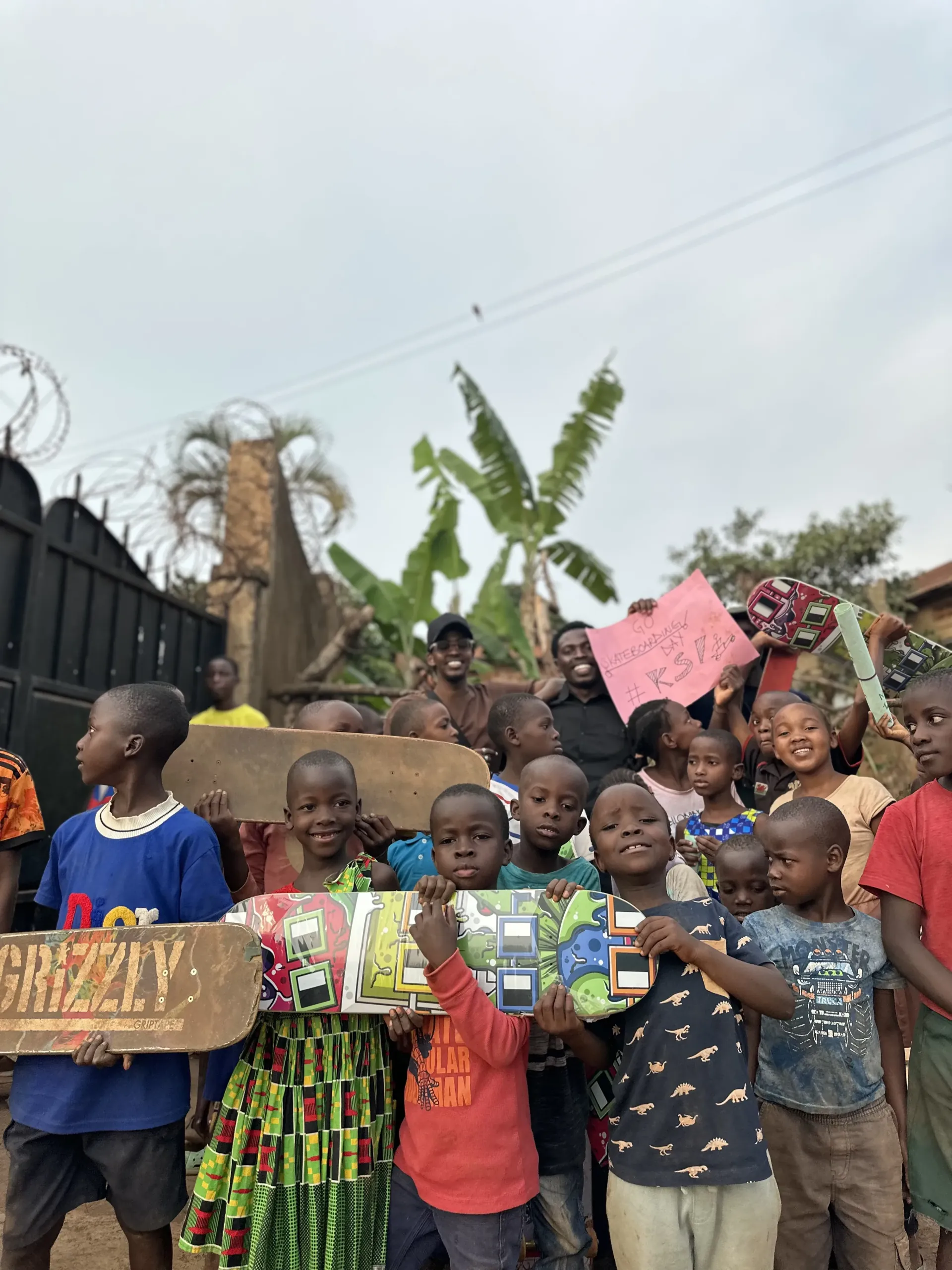 KSI community — children and youth with skateboards in Kampala