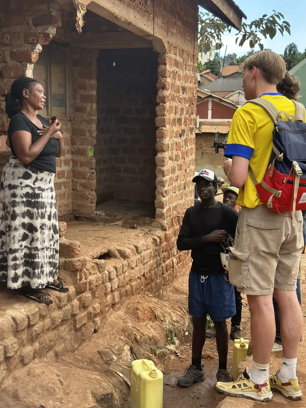 KSI members at a construction site for community development